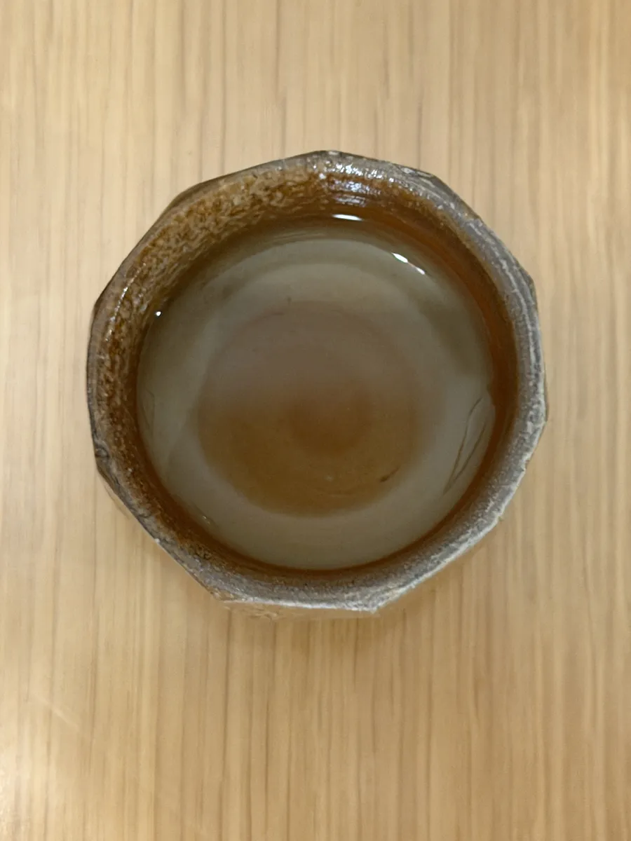 Sake seen from above inside the Bizen guinomi