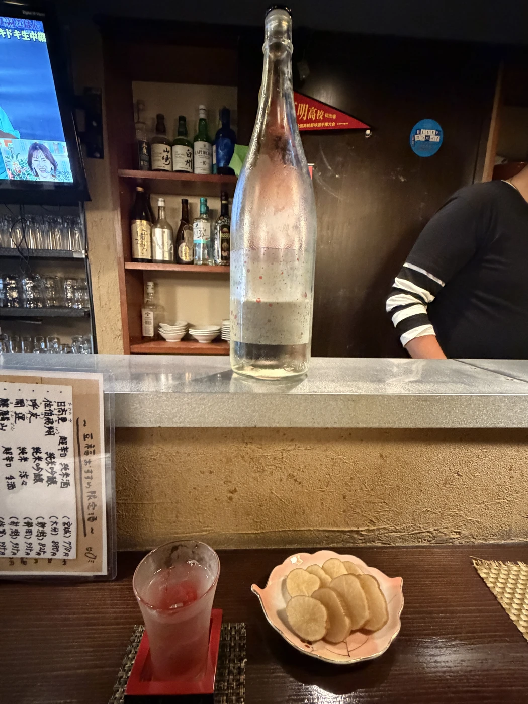 Senkin Senko-Hanabi served with iburigakko at a sake izakaya in Kumamoto